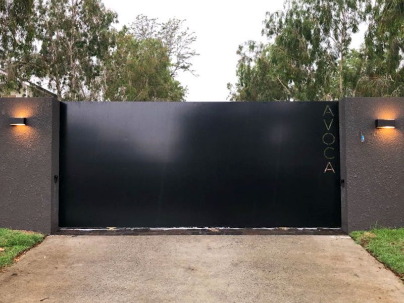 Flat sheet sliding gate, dark, rendered piers