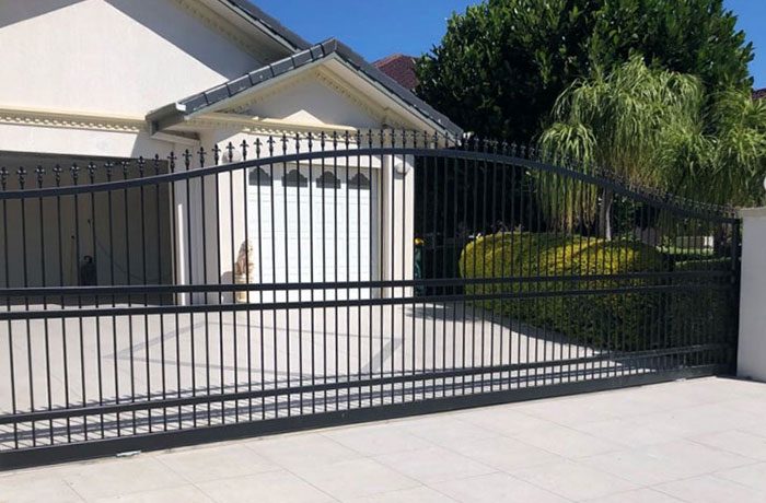 Black vertical slat sliding gate